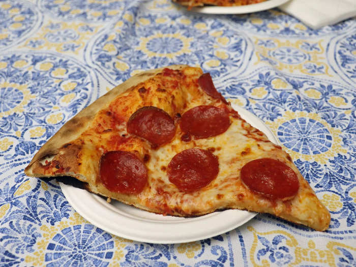 This slice of pepperoni pizza cost $11 and 30 minutes of wait time.