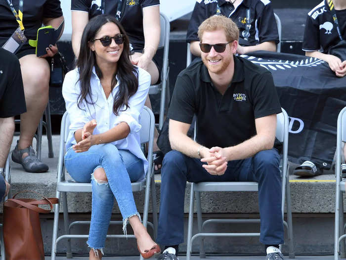 At her first public appearance with Prince Harry in September 2017, Meghan seemed to straddle the line between her style as an actor and that of a royal. She paired a conservative button-up top with ripped jeans.
