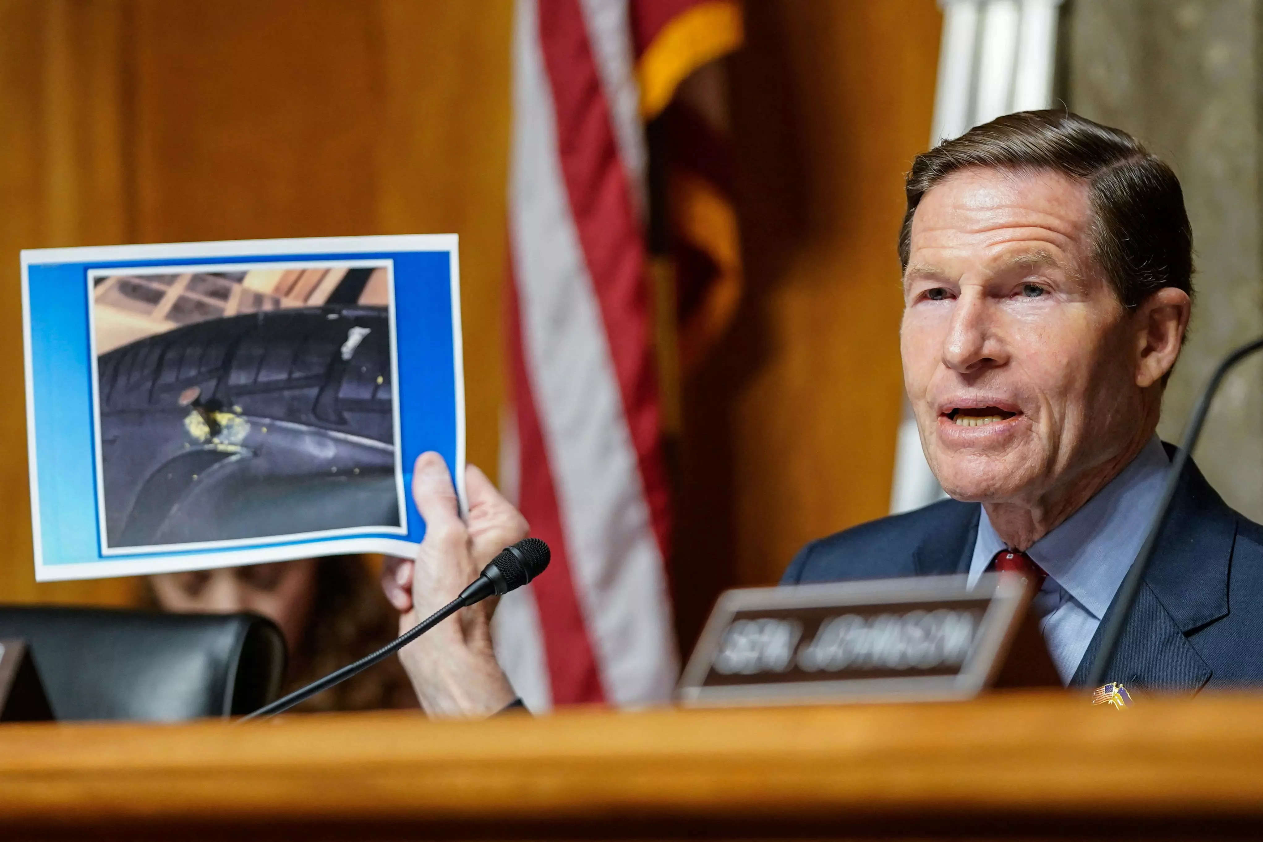Committee Chairman, US Senator Richard Blumenthal, Democrat of Connecticut, holds a picture of a nail in a tire that Boeing engineer, Sam Salehpour said he believes was placed intentionally in his car tire as retaliation for being a whistleblower.