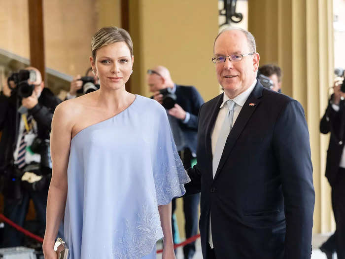 Princess Charlene of Monaco wore a one-shoulder top to a pre-coronation event at Buckingham Palace in May 2023.