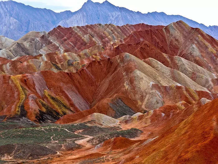 At Zhangye Danxia Landform Geological Park in Zhangye, China, precipitated groundwater leaves colorful mineral deposits in the mountains.