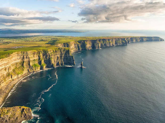 The rugged Cliffs of Moher in County Clare, Ireland, offer unparalleled views of the ocean below.