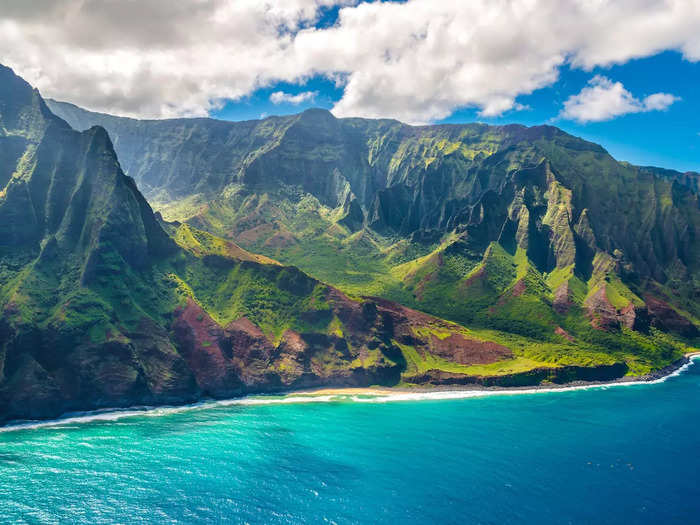 Between the colorful cliffs and the azure-blue waters below, Hawaii