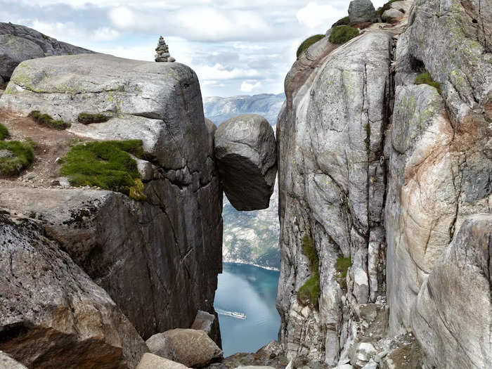 Kjeragbolten is a 177-cubic-foot boulder nestled in a mountain crevice in Norway.
