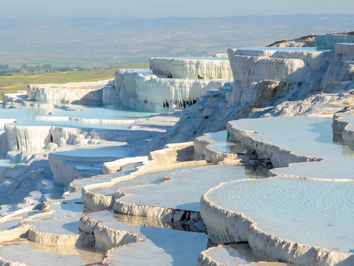 In Pamukkale, Turkey, terraces hold warm water pooled from natural hot springs.