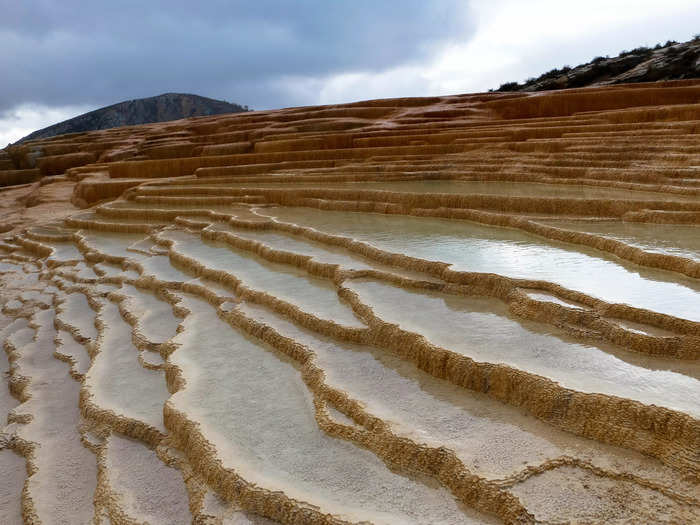 The terraces at Badab-e Surt in Iran were created after two mineral hot springs eroded away rock over thousands of years, leaving behind deposits that give the site its unique shape.