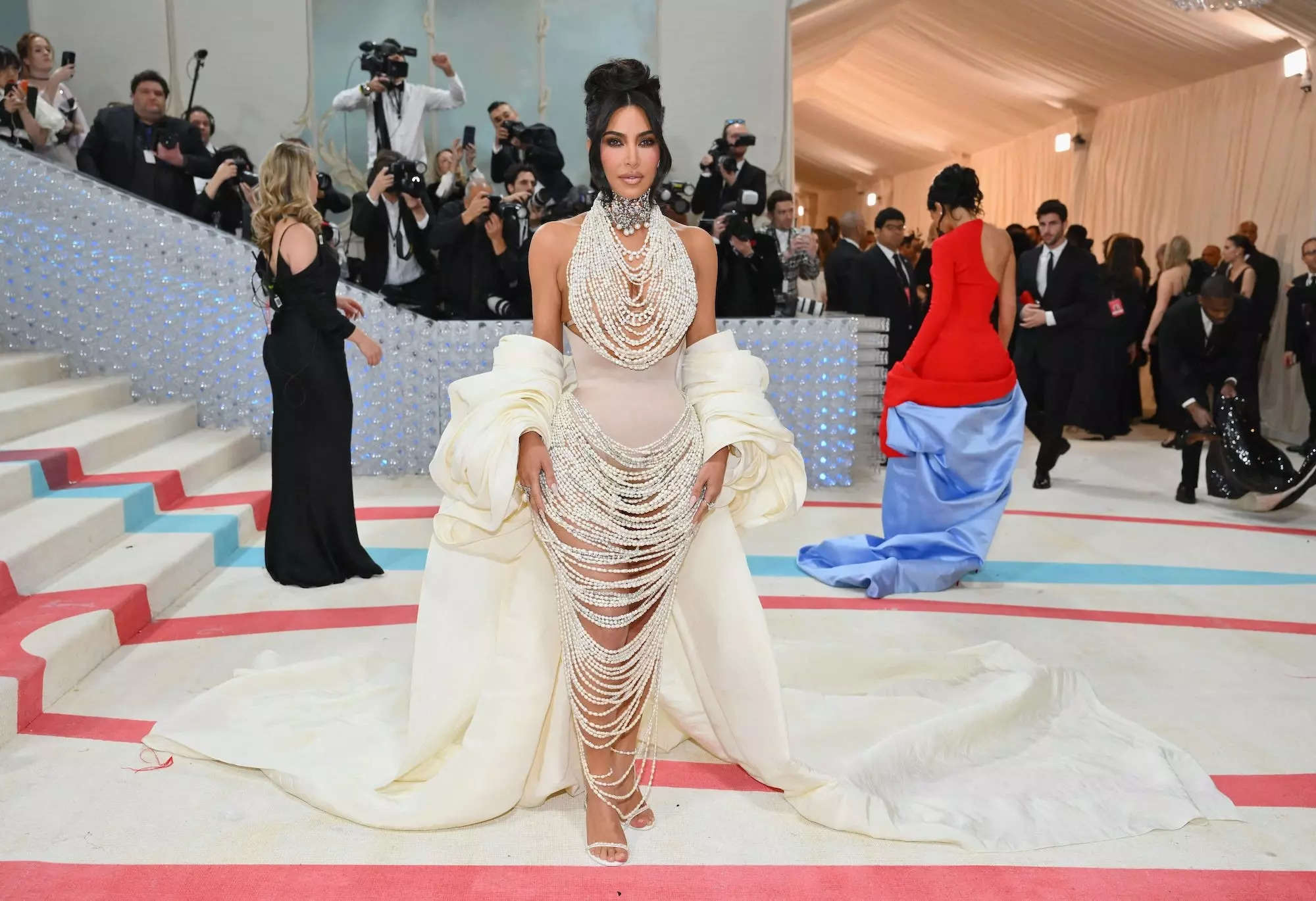 Kim Kardashian poses for photographers at the bottom of the Met Gala
