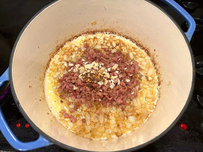 I added the pancetta back into the Dutch oven, along with the minced garlic and red pepper flakes.