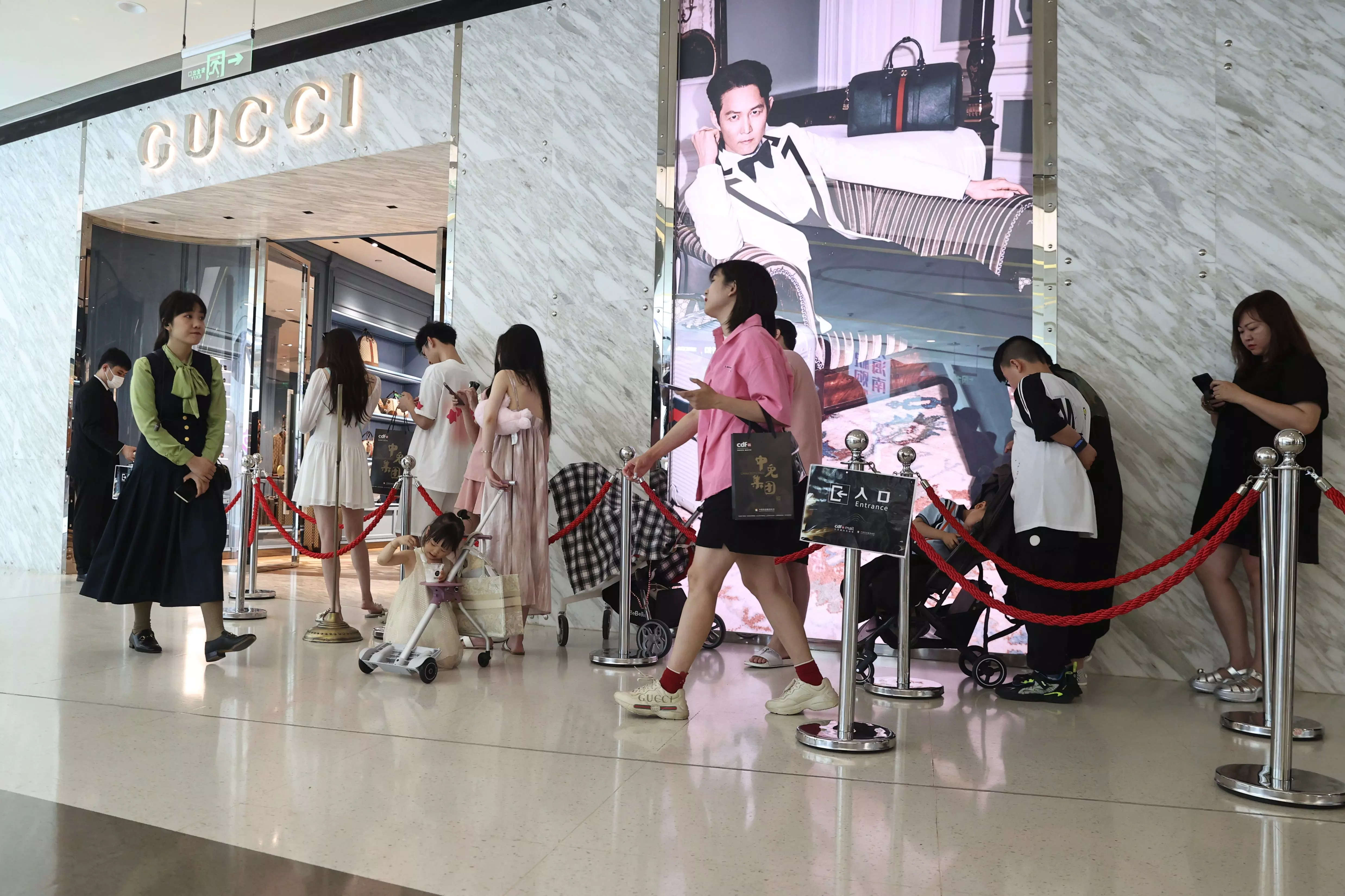 Customers enter a Gucci store at Sanya International Duty Free Shopping Complex on June 28, 2023 in Sanya, Hainan Province of China. (Photo by Jiang Qiming/China News Service/VCG via Getty Images)