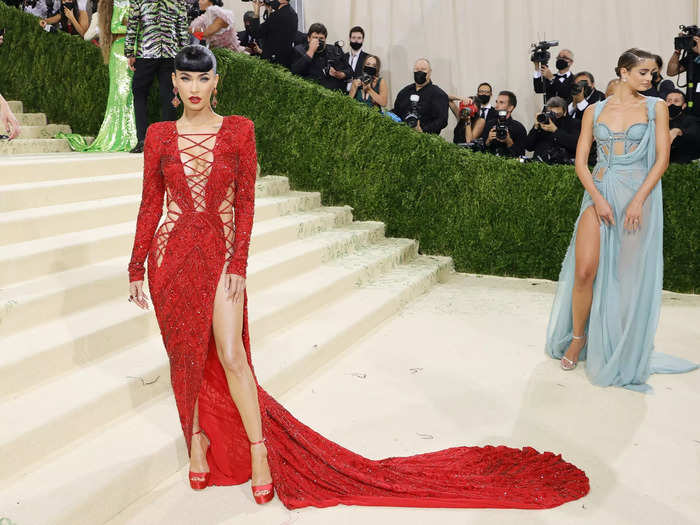 Megan Fox stole the show at the gala in a red Dundas gown with criss-cross cutouts and a high slit.