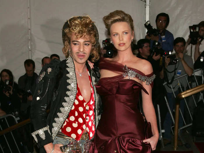 Charlize Theron hit the red carpet in 2006 wearing a beautiful burgundy gown by Christian Dior.