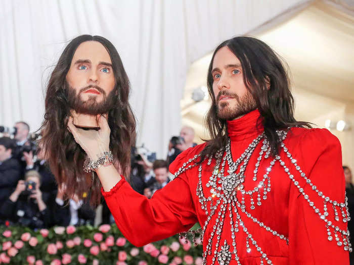Jared Leto walked the red carpet holding a model of his own head.