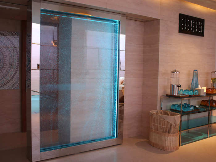 Next to the cafe, an automatic door filled with water and bubbles slides open to the pool and steam rooms.