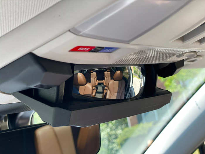 Near the rearview mirror is a sunglass holder with an integrated panoramic mirror handy for keeping tabs on the rest of the cabin.