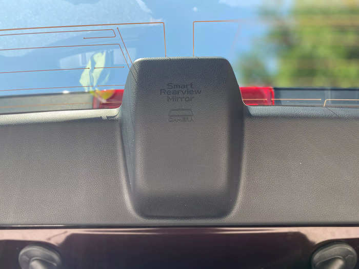 The rear camera itself is located on the tailgate at the top of the rear window.  
