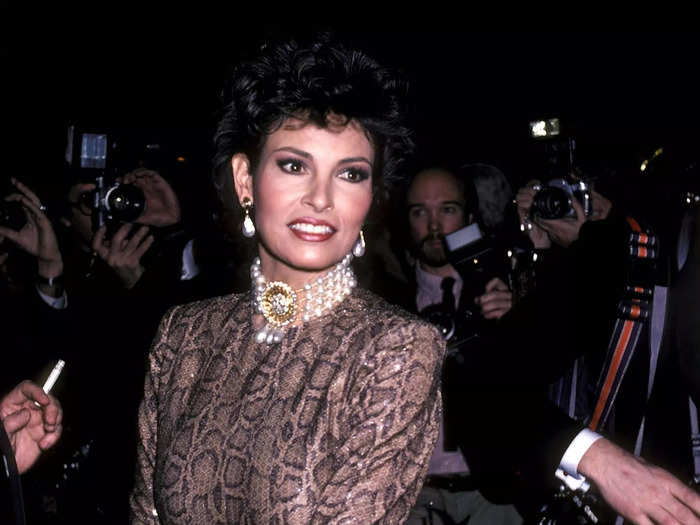 Raquel Welch stole the show at the 1982 Met Gala in a shimmering long-sleeved cheetah print dress, complete with a pearl choker. 