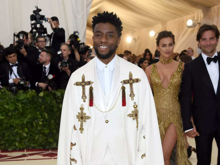 Chadwick Boseman looked like royalty in a white suit embellished with gold pieces.