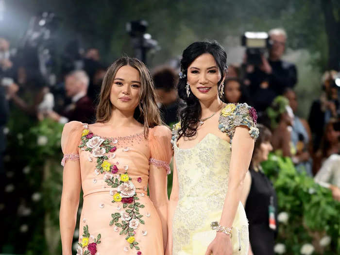 The floral accents on Grace Murdoch and Wendi Deng Murdoch