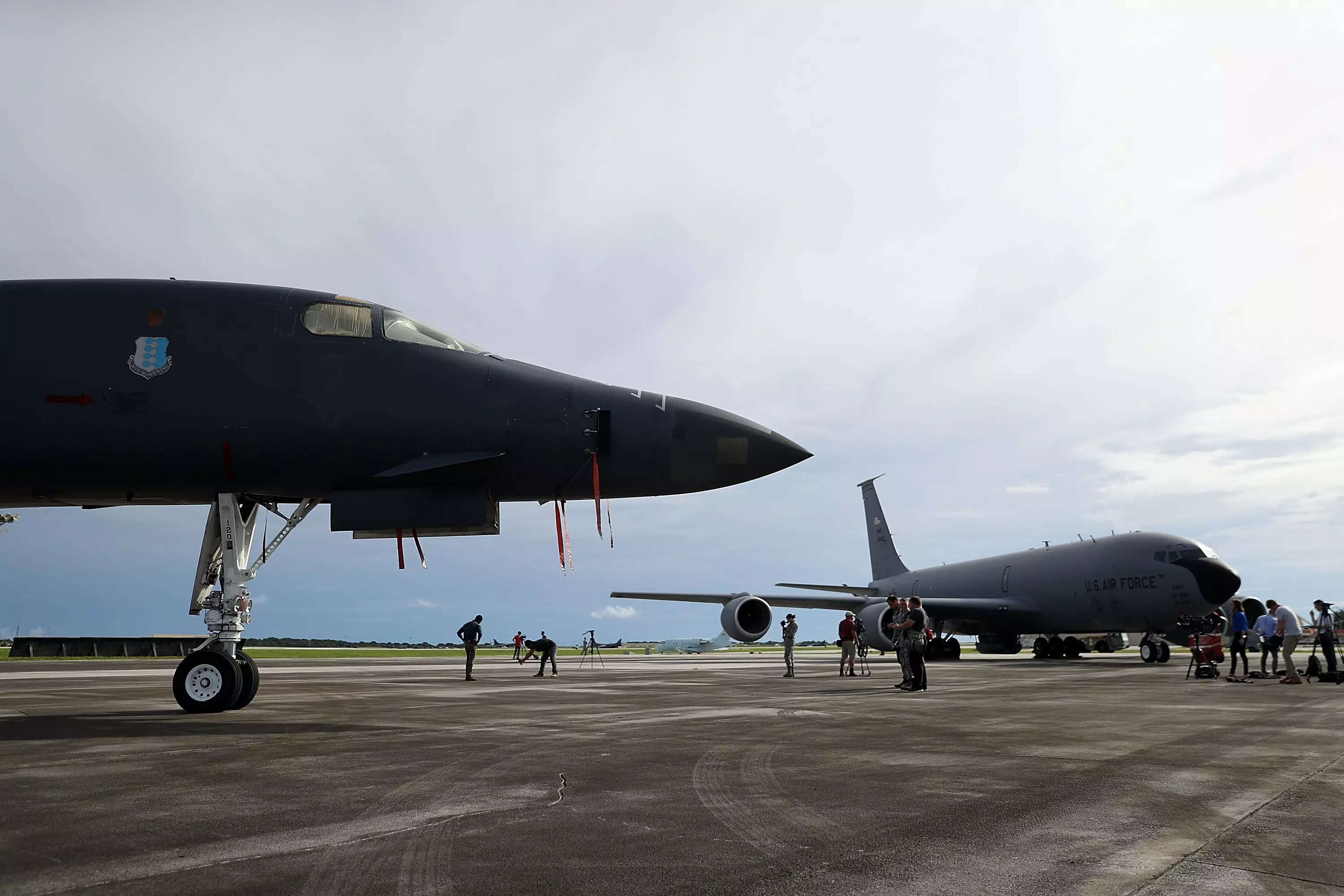 A U.S. Air Force Rockwell B-1B Lancer (L) and a Boeing KC-135 Stratotanker (R) sit on the tarmac at Andersen Air Force base on August 17, 2017 in Yigo, Guam.
