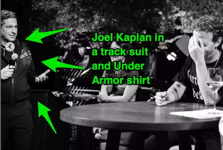Joel Kaplan holding a mic wearing a track suit