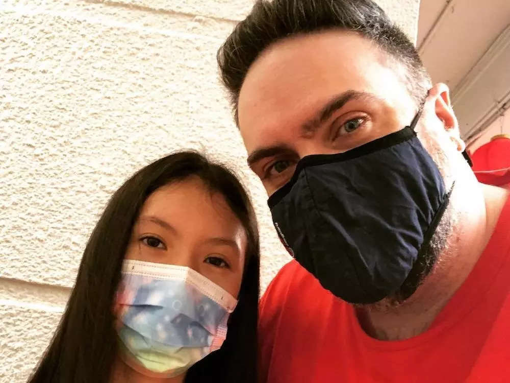Daughter and father wearing face masks