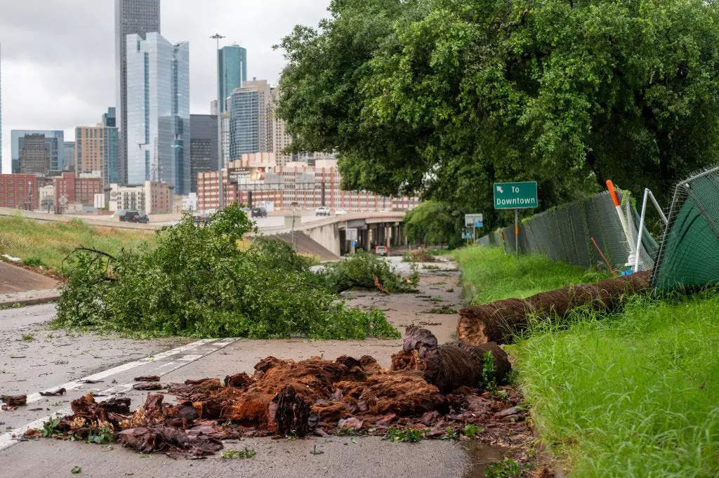 Debris fills the feeder road near Interstate 10 and Interstate 45 near downtown Houston after severe storms passed through the area Thursday, May 16, 2024