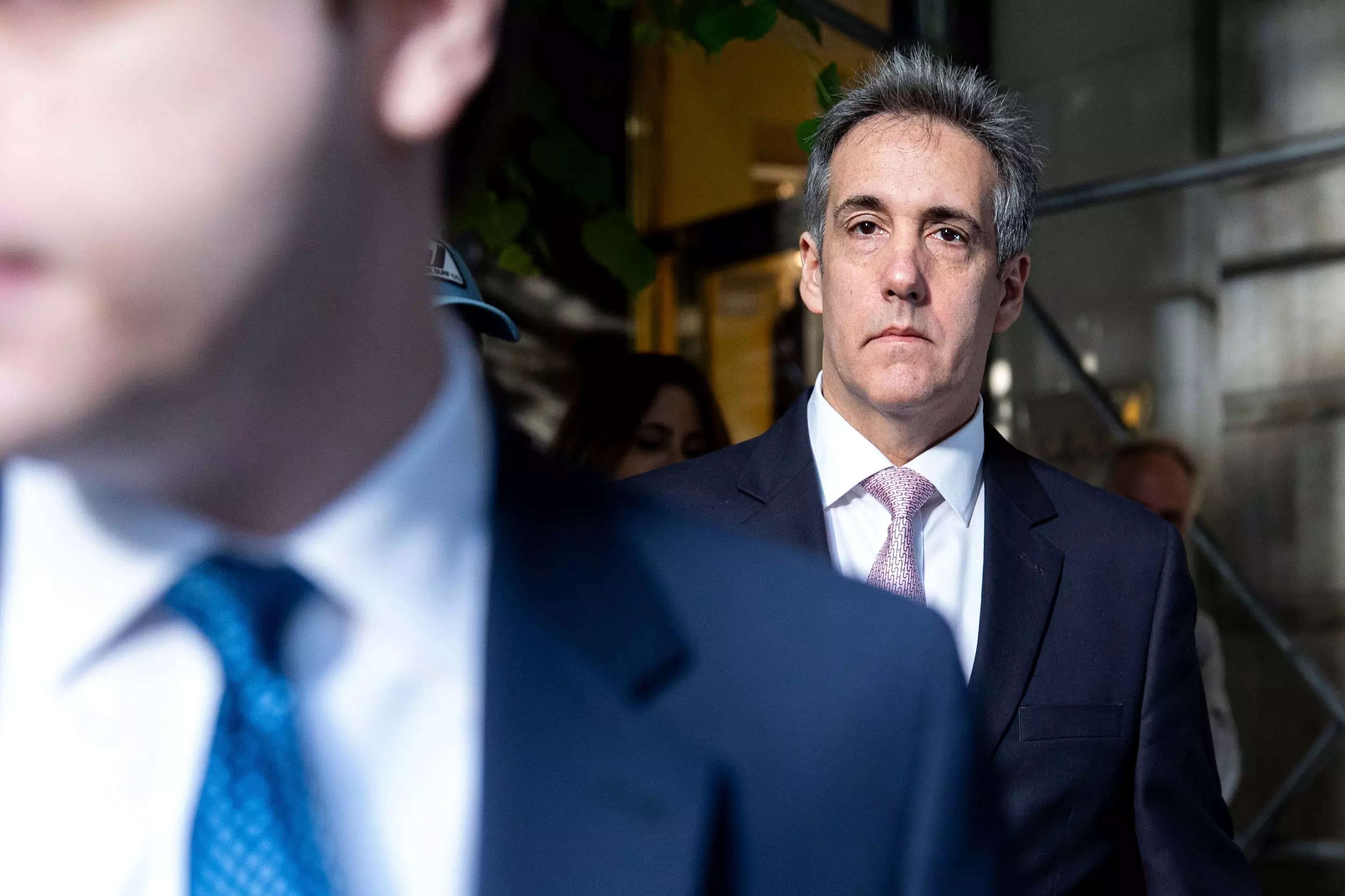 Michael Cohen is shown leaving his apartment to attend the hush money trial in New York.