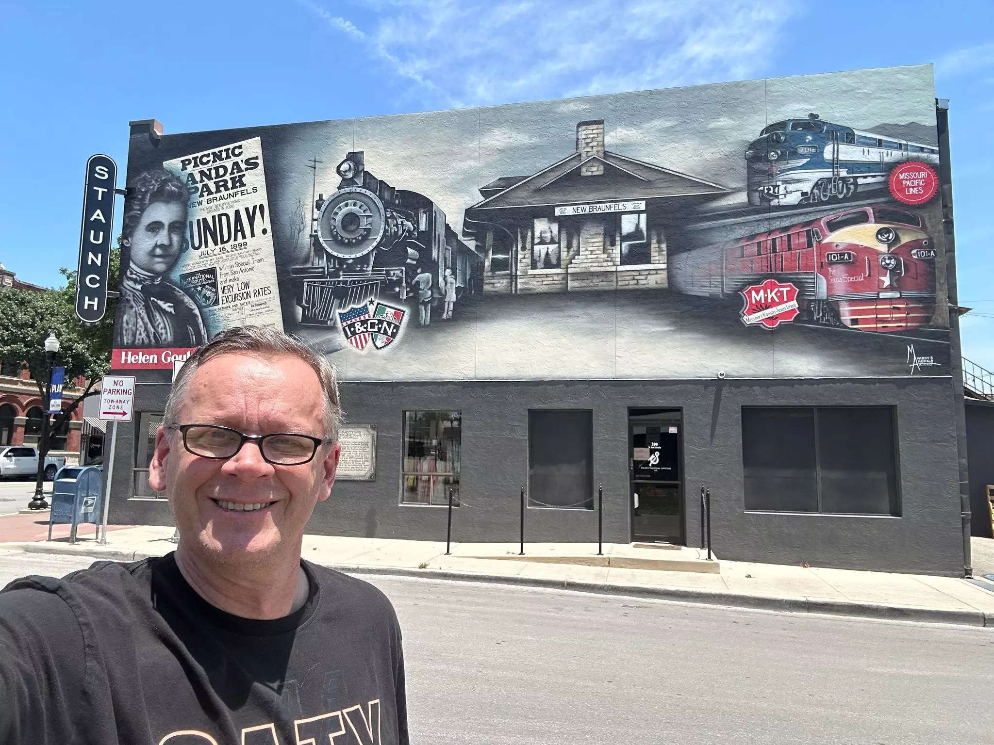 Eric Newland in front of a train Mural near New Braunfels