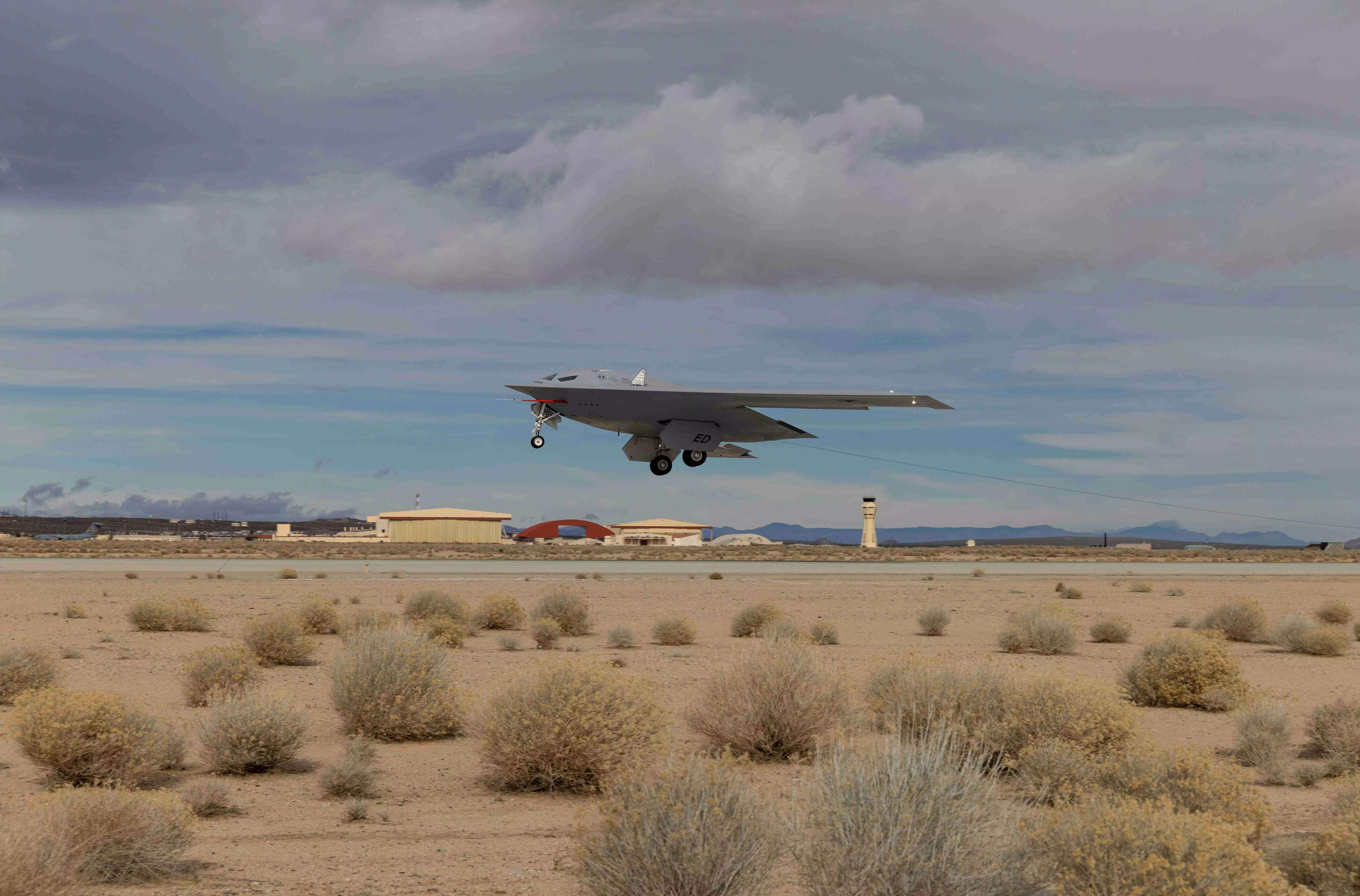 A B-21 Raider conducts flight tests, which includes ground testing, taxiing, and flying operations, at Edwards Air Force Base, California.