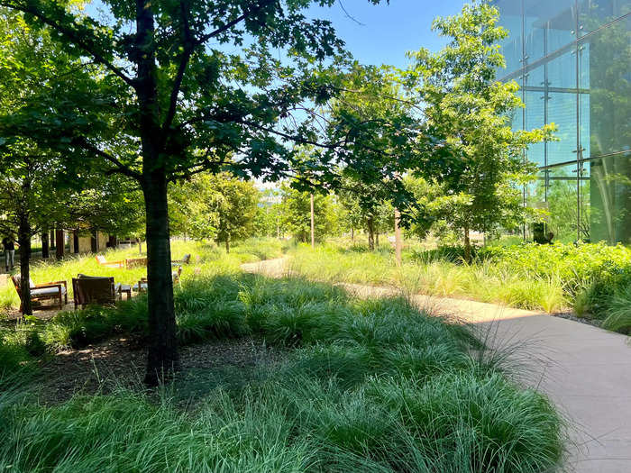 The sitting area outside the food hall stretches into a large courtyard where employees can access sports courts and walking trails.