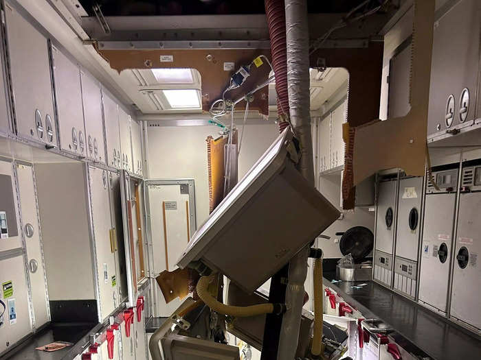 More damage was apparent in the galley, with tubes coming out of the ceiling.