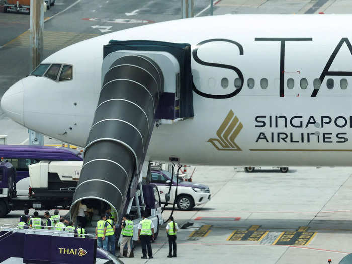 The plane was met by airport officials and medical teams at Bangkok’s Suvarnabhumi Airport.