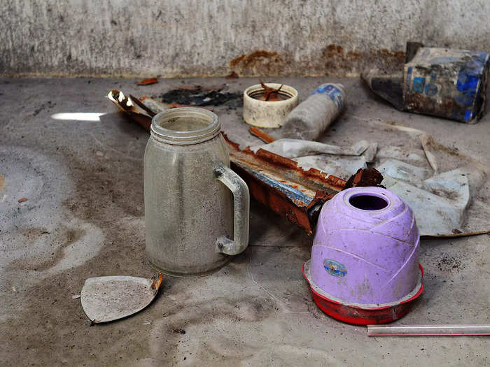 Kitchen appliances and dishware give light to the people who once lived in these homes.