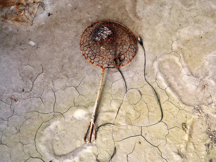 Kitchen items, like this strainer, have been left behind as villagers hurried to evacuate their homes.