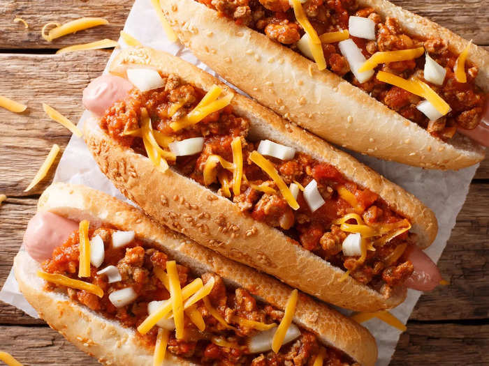 Chili and shredded cheese make for a classic hot-dog combination.