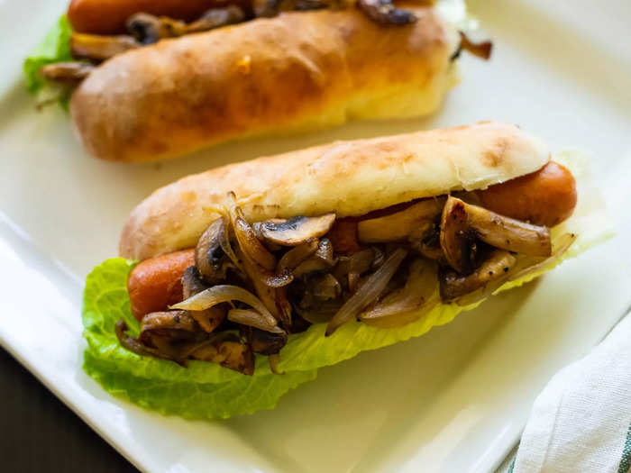 Sautéed mushrooms add a rich, earthy flavor to hot dogs.