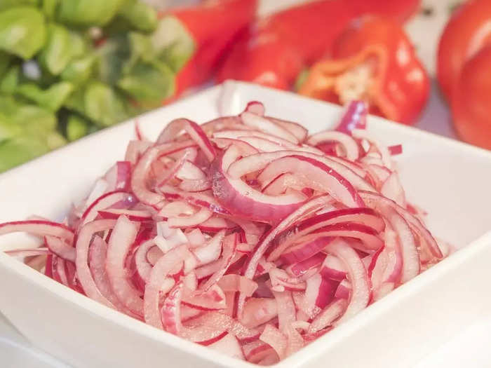 Quick pickled onions add a slightly tangy taste to hot dogs, and they