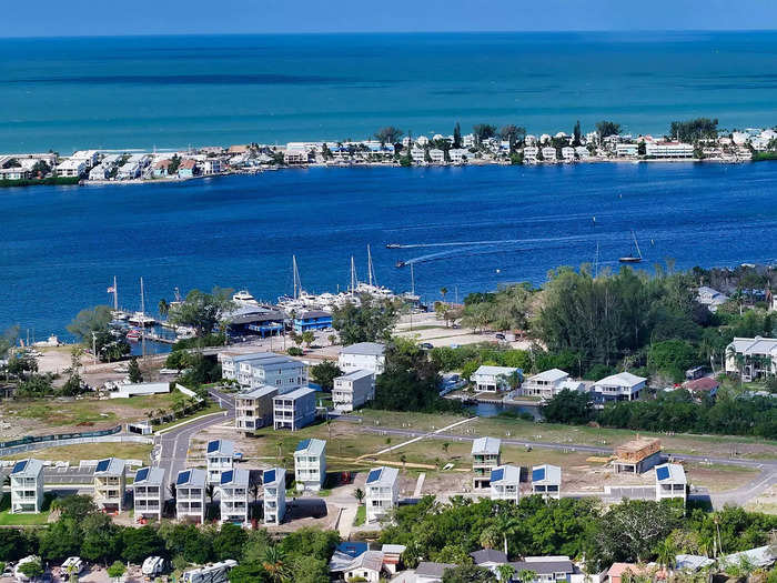 The Hunters Point community sits on a bay separated from the Gulf of Mexico by a barrier island. 