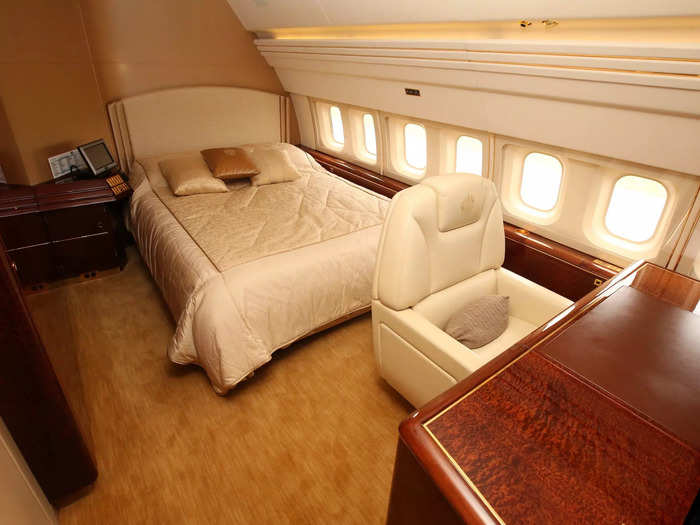 The customized plane has living rooms, bedrooms, televisions, gold-plated seatbelts, and a dining room, among other luxuries.