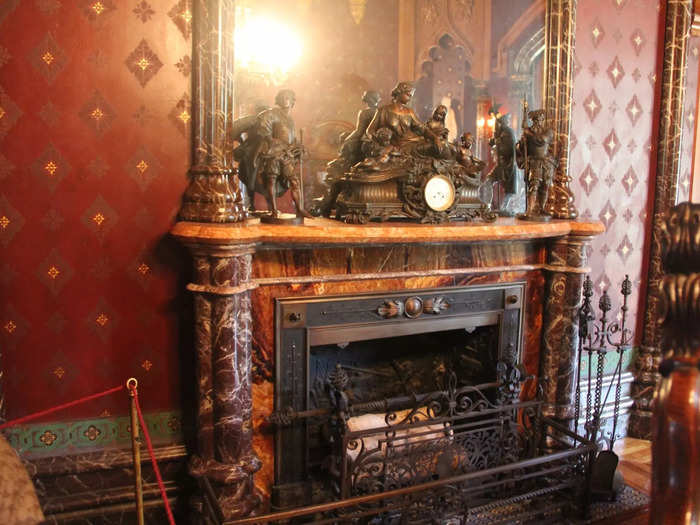 The fireplace was made of red-grain marble, but its columns were handpainted with a marble pattern over plaster and wood.