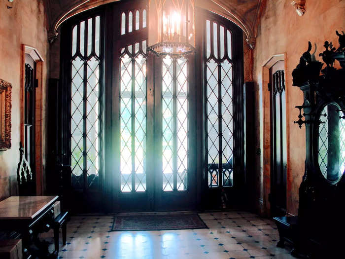 The grand entryway featured a marble floor and four closets.