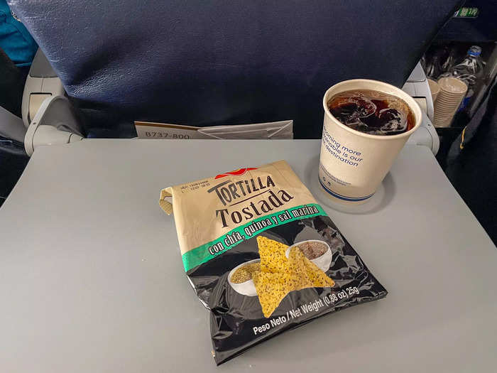 Tortilla chips were the only free snack offered to economy passengers. For drinks, I picked from the typical slew of juices, sodas, teas, and coffee. 