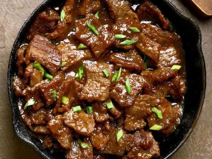 Mongolian beef made with flank steak, garlic, ginger, brown sugar, and soy sauce is a perfect weeknight meal.