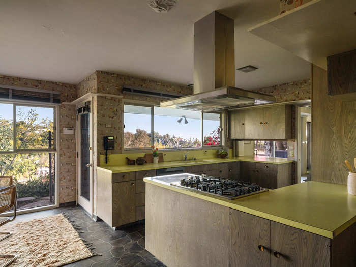 With panoramic views throughout, the kitchen overlooks the nearby hills.