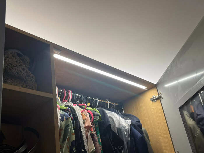 LED lighting inside the cabinetry and closets make the tight spaces feel warm and accessible. 