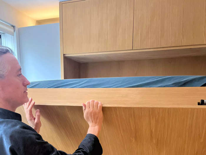 A queen-sized Murphy bed is easy to pull down. 