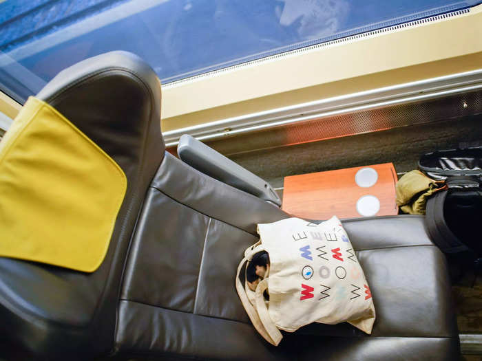 When I got to my assigned single seat, I was surprised to find that I had a side table in addition to a tray table that pulled out in front of me.