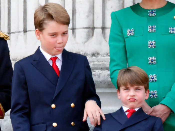 Both George and Louis made silly faces as they watched the fanfare in matching blazers and ties.