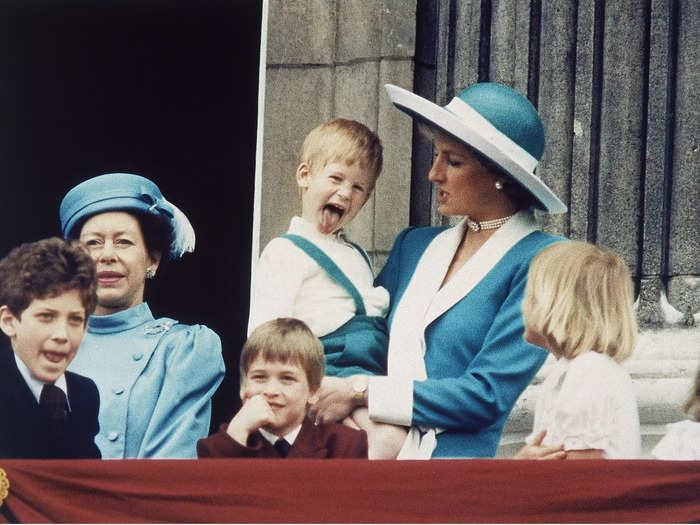 Prince Harry was photographed sticking his tongue out at cameras while Princess Diana held him at the 1988 parade.