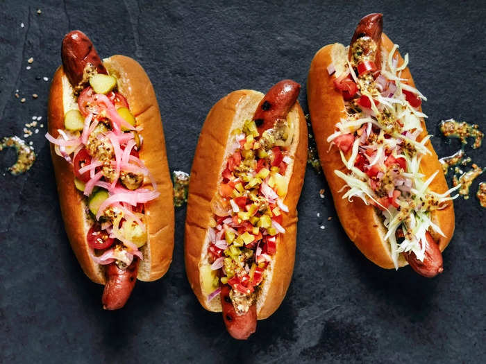 Adding sugar-based sauces while the hot dogs are on the grill can take them up a notch.
